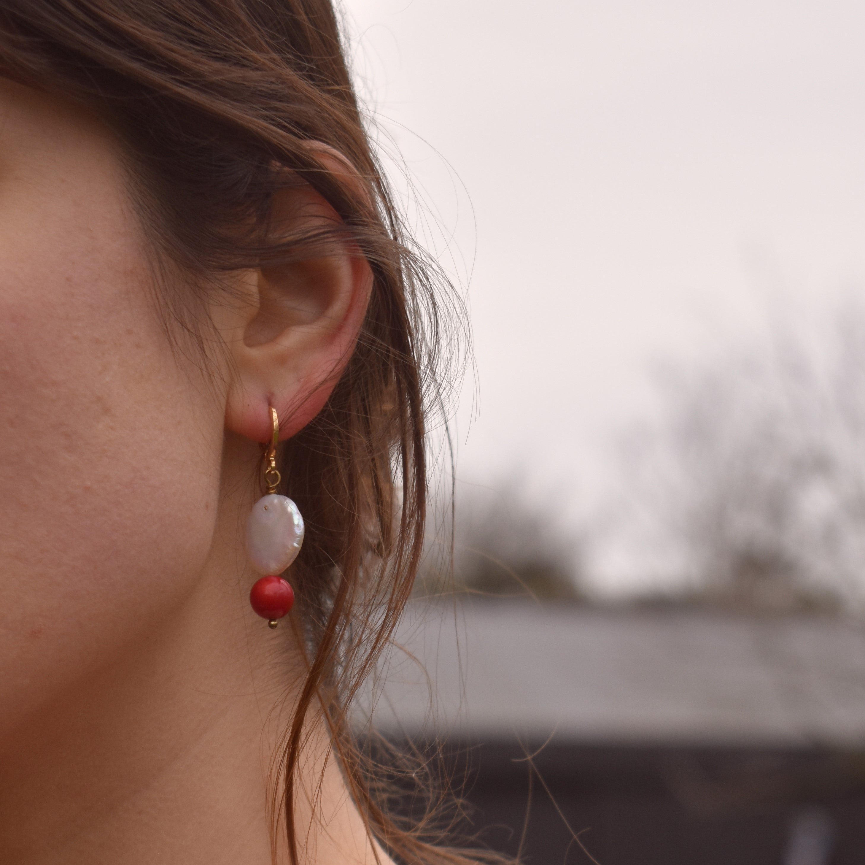 Coin freshwater pearl huggie earrings with red coral bead | by Ifemi Jewels